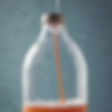 A close-up of a balloon attached to a bottle filled with baking soda and vinegar