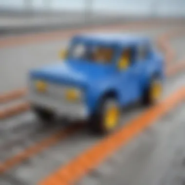 Finished blue LEGO car speeding on miniature track